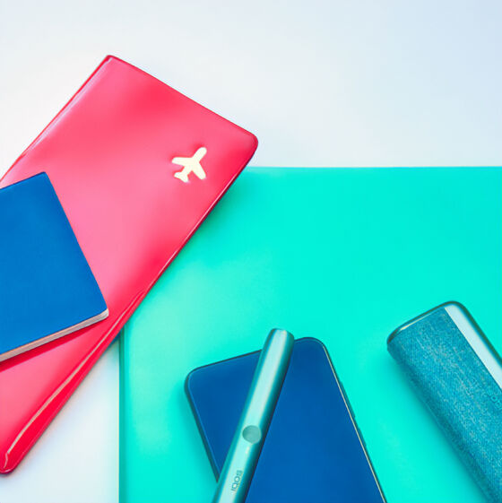 Gold IQOS DUO in its packaging on a blue table