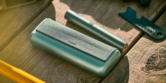 A jade green IQOS ILUMA PRIME Pocket Charger and Holder.
