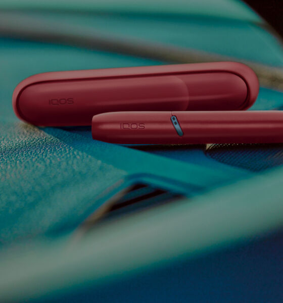 IQOS Originals Duo holder and pocket charger in red color.