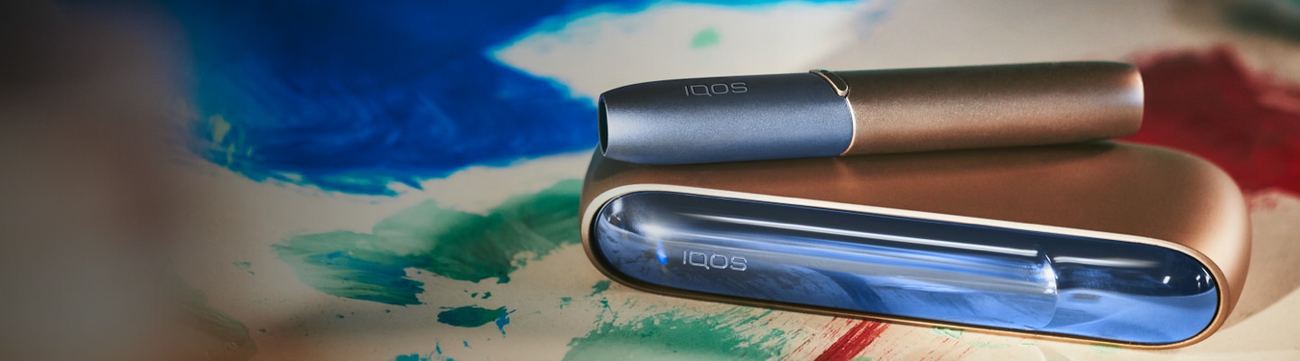 A gold IQOS device.